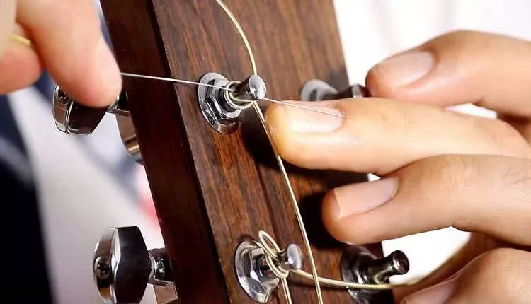 364a838-cambiar-cuerdas-de-guitarra